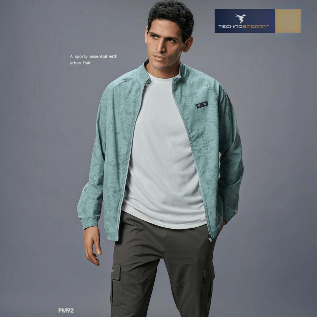 City Center Technosport men's light green hi-neck zip-up jacket with all-over print, worn by a male model.