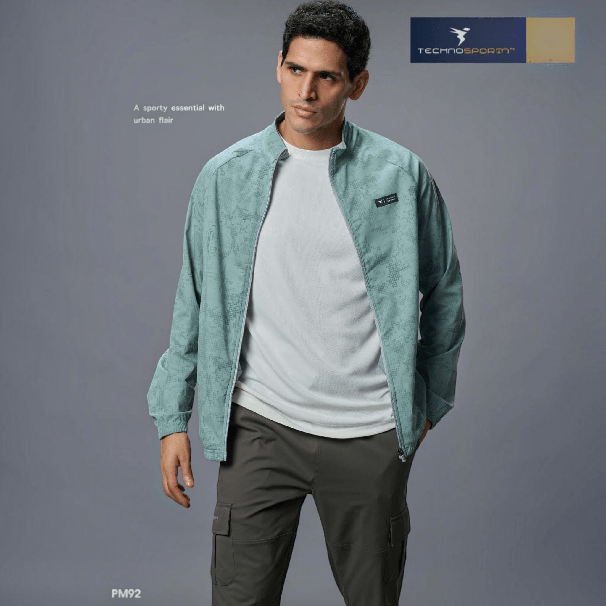 City Center Technosport men's light green hi-neck zip-up jacket with all-over print, worn by a male model.