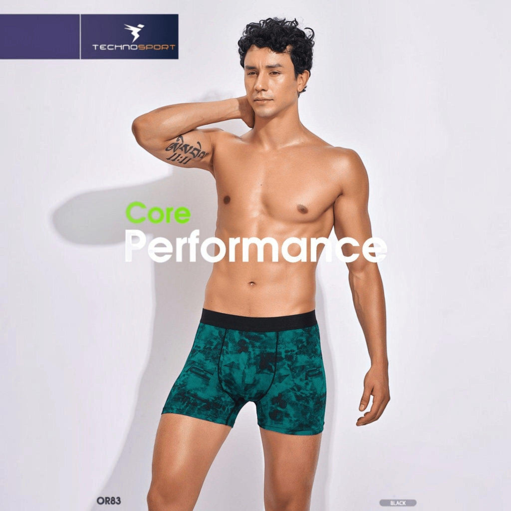 City Center Technosport men's green patterned performance trunk with a black elastic waistband on a male model