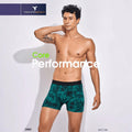 City Center Technosport men's green patterned performance trunk with a black elastic waistband on a male model