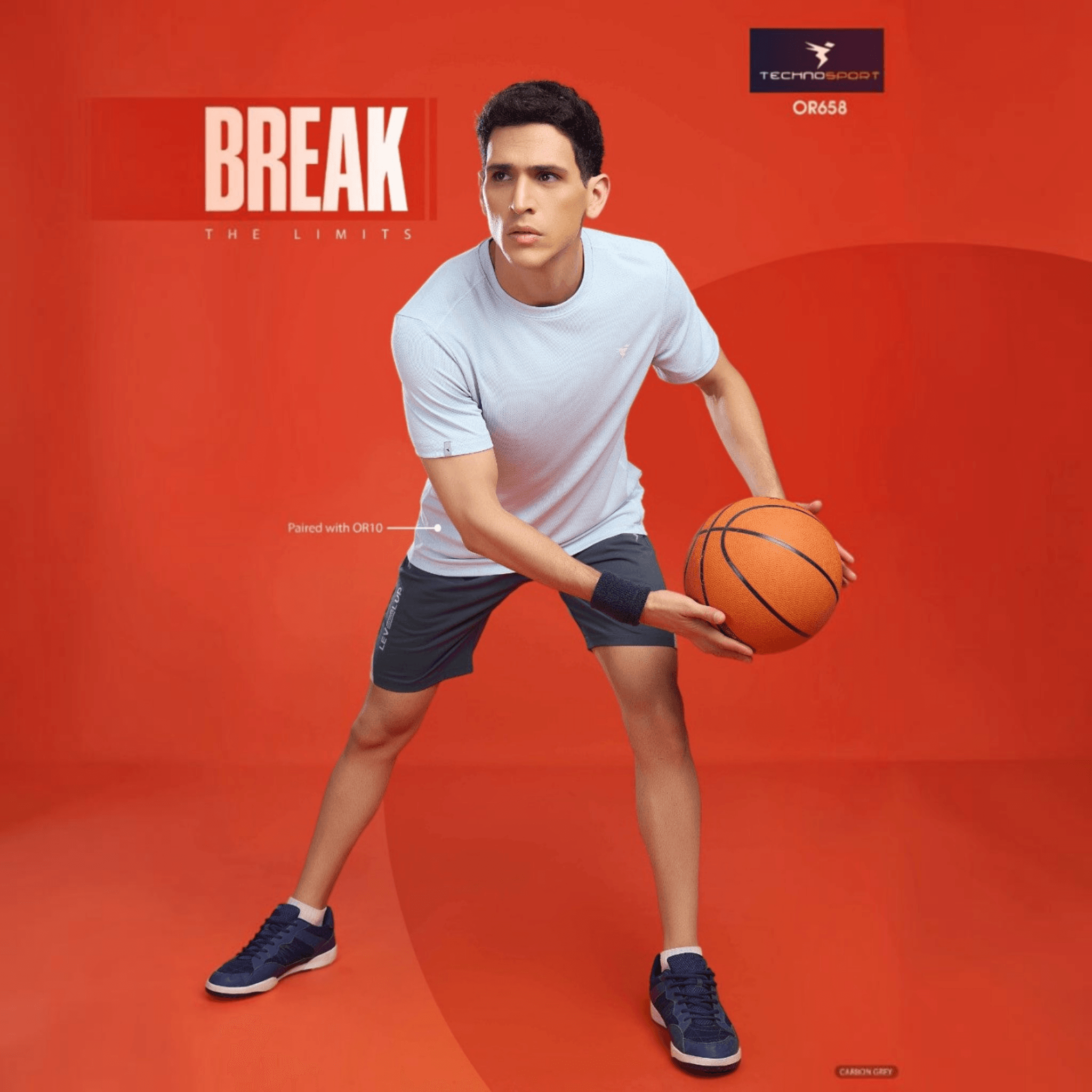 City Center Technosport men wearing grey 4-way stretch crispy shorts and light blue t-shirt holding a basketball