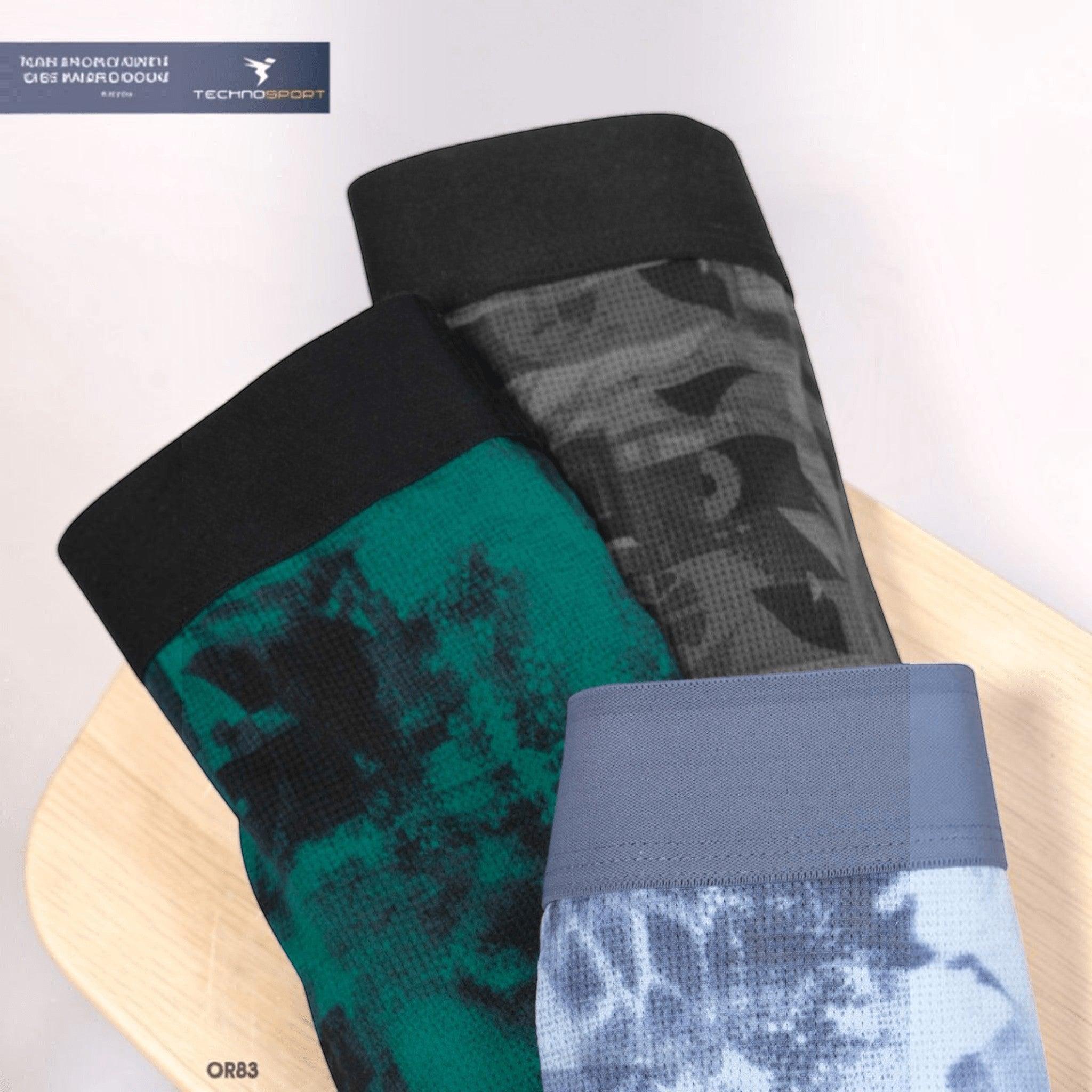City Center Technosport Men’s Trunk OR83 featuring ElastoLITE fabric in green, grey, and blue camo prints.