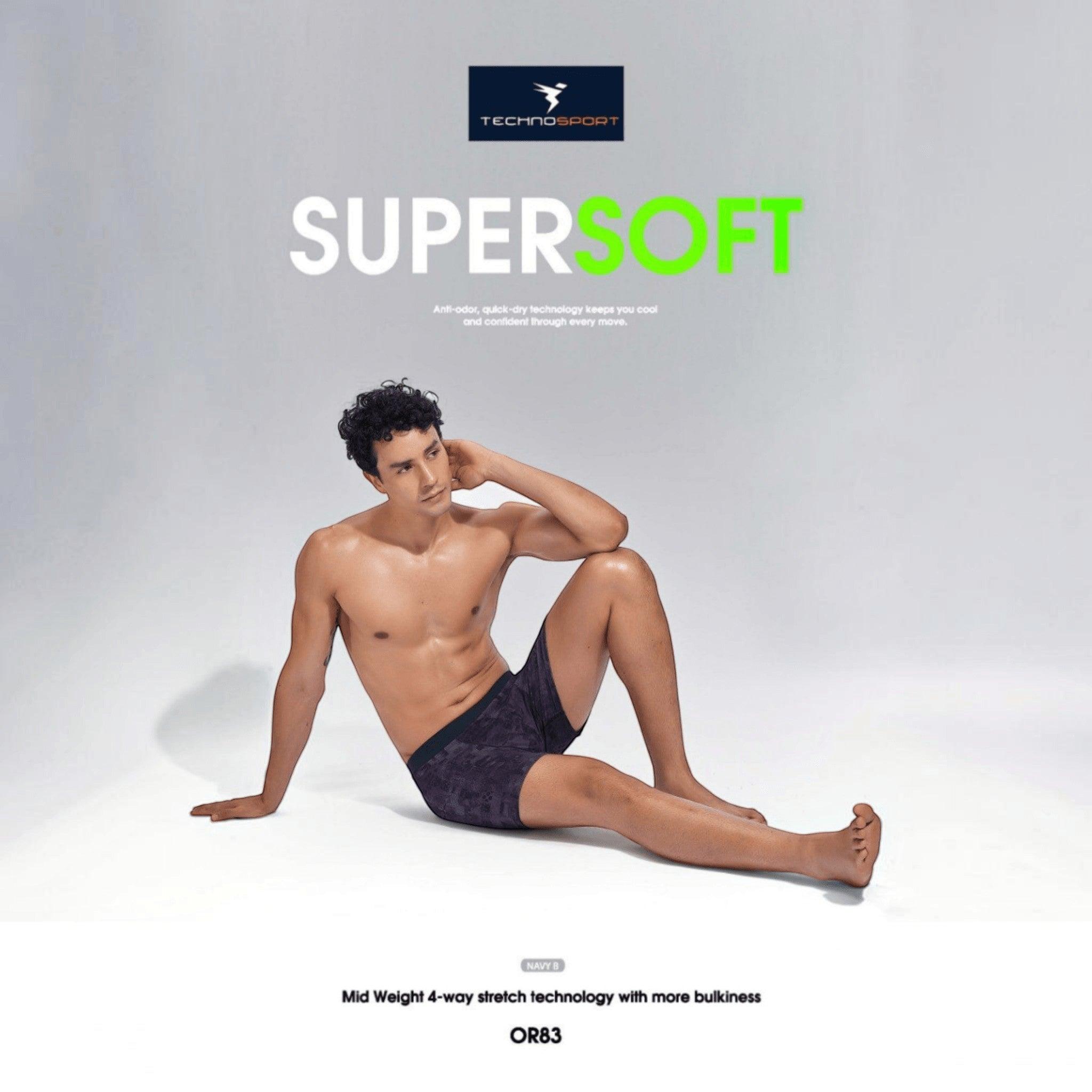 City Center model wearing Technosport ElastoLITE navy patterned trunk with 4-way stretch and moisture-wicking fabric