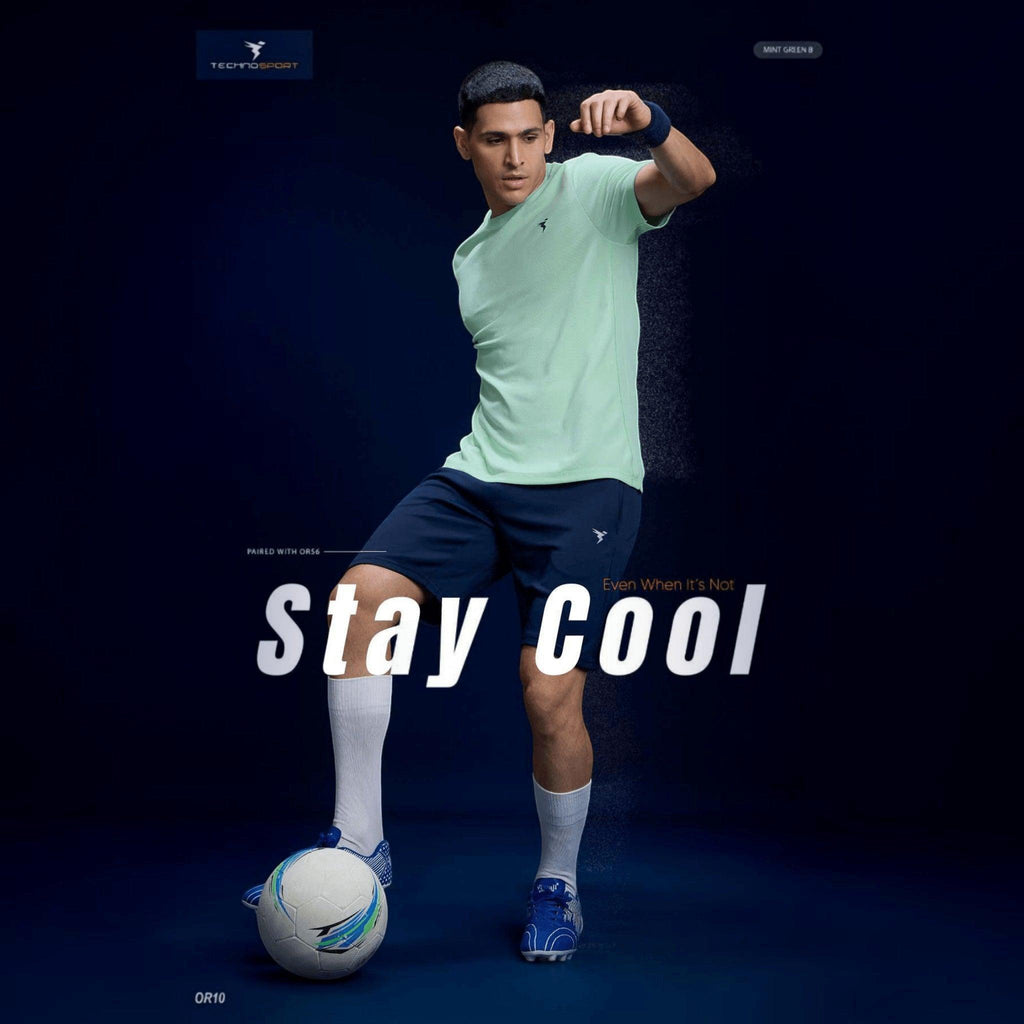 City Center Technosport mint green crew neck slim fit performance t-shirt worn by a male athlete playing soccer