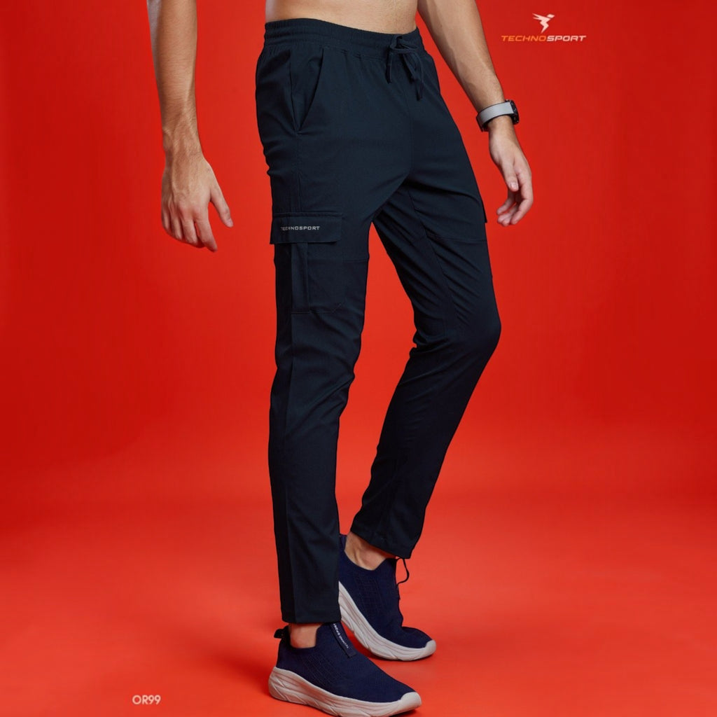 City Center Technosport TS Flexi solid woven navy cargo pants with side pockets on a model against a red background