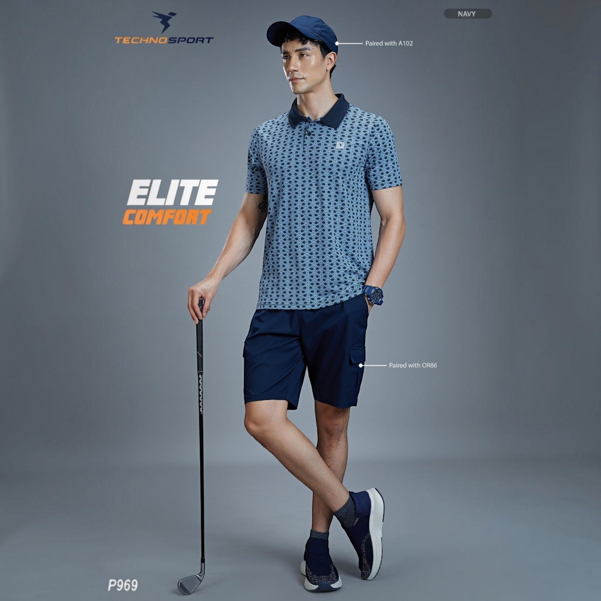 City Center model wearing a navy blue patterned Technosport P969 performance polo shirt with matching navy shorts.