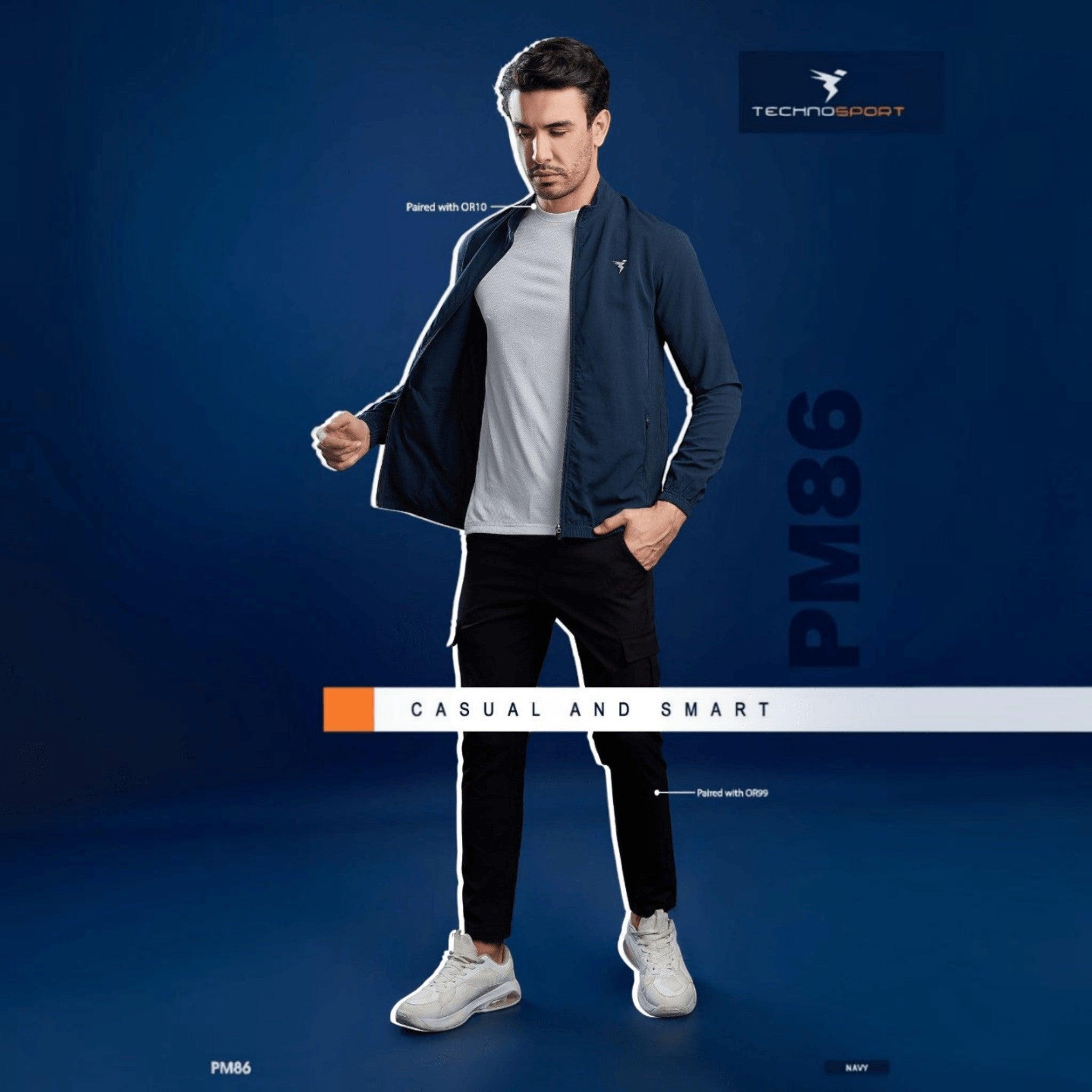 City Center model wearing a navy Technosport slim-fit hi-neck jacket over a grey t-shirt and black trousers