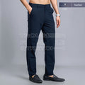 City Center Technosport DuraCool+ navy blue slim fit stretch casual trousers worn by a man with black loafers