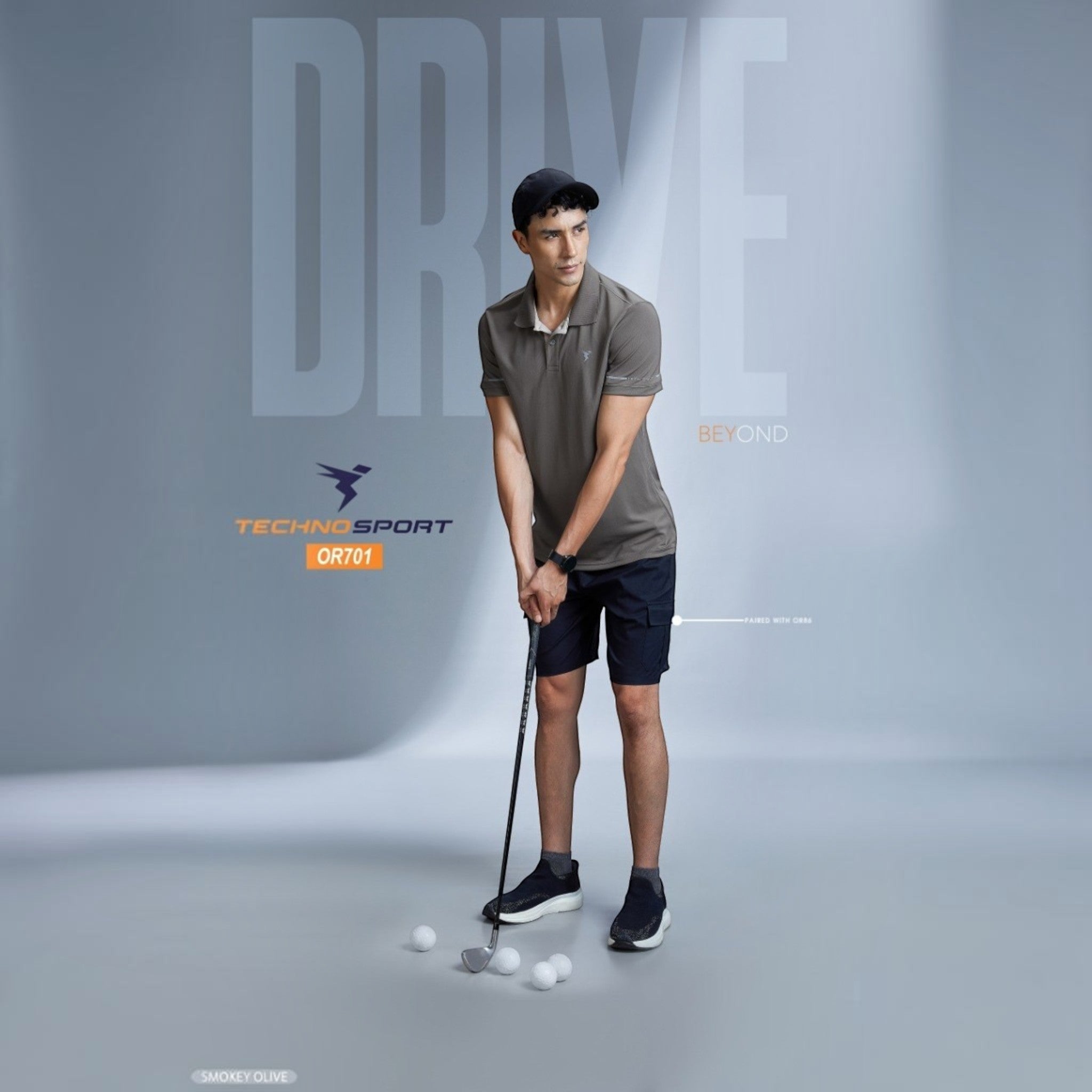 City Center OR701 Technosport men's premium polo shirt in smokey olive, worn by a golfer with shorts and cap.