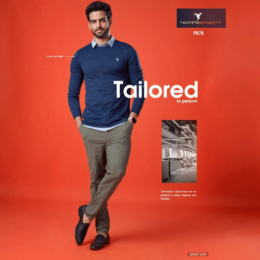 City Center Technosport Duracool+ solid olive green 4-way stretch casual trousers worn by a model on an orange background