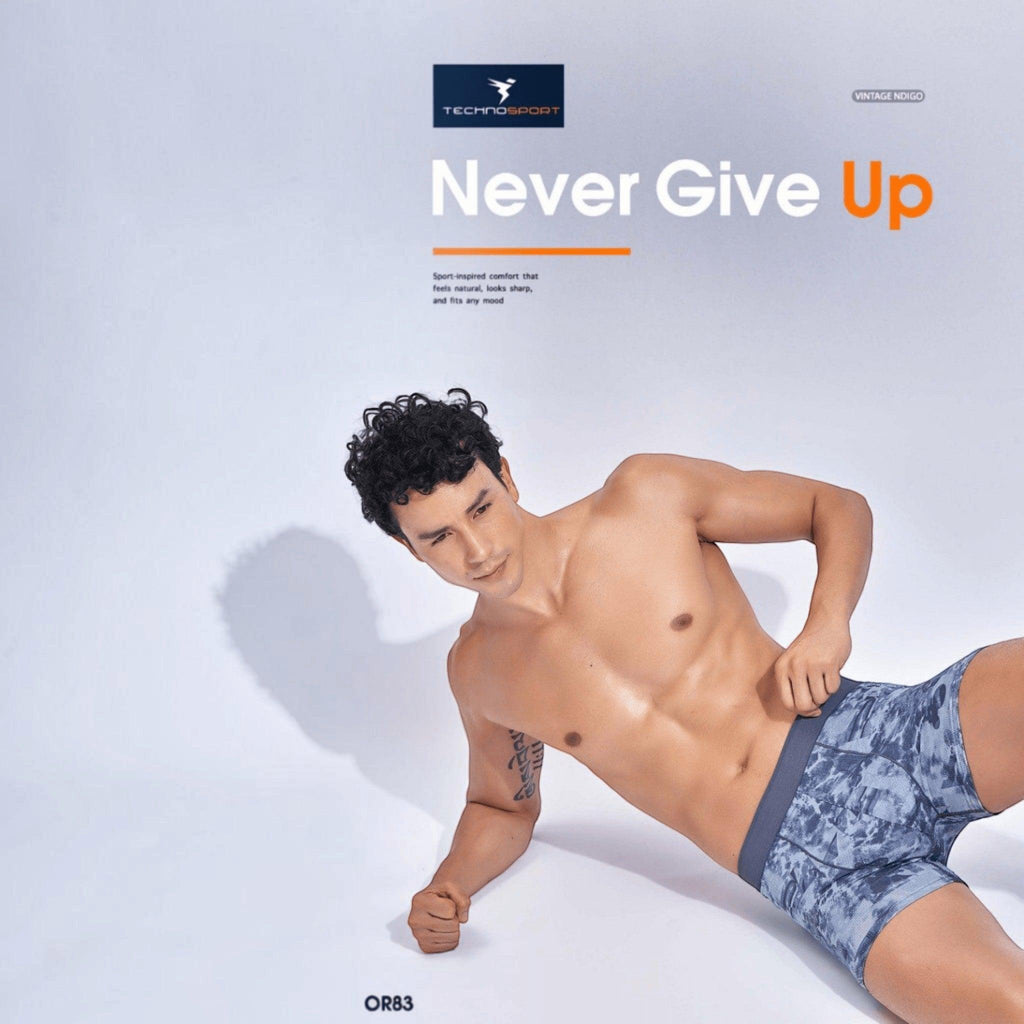 City Center model wearing Technosport ElastoLITE performance trunk in vintage indigo with all-over print design