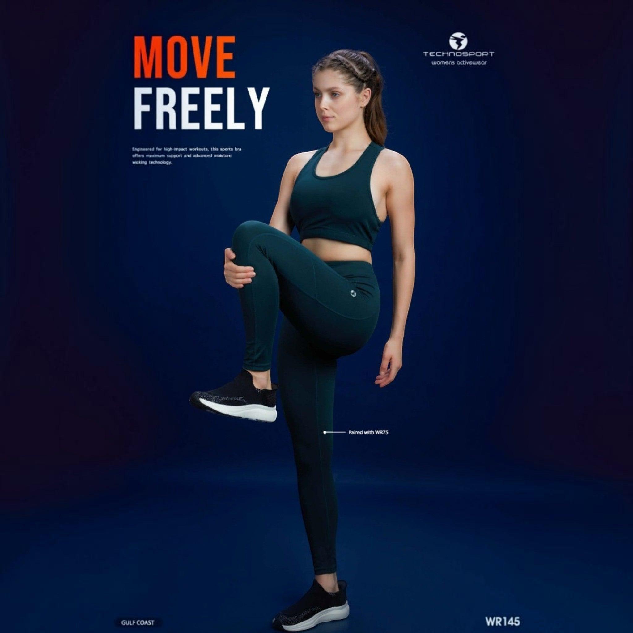 City Center Technosport Elastoplus racer back sports bra in dark green worn by a model during a workout