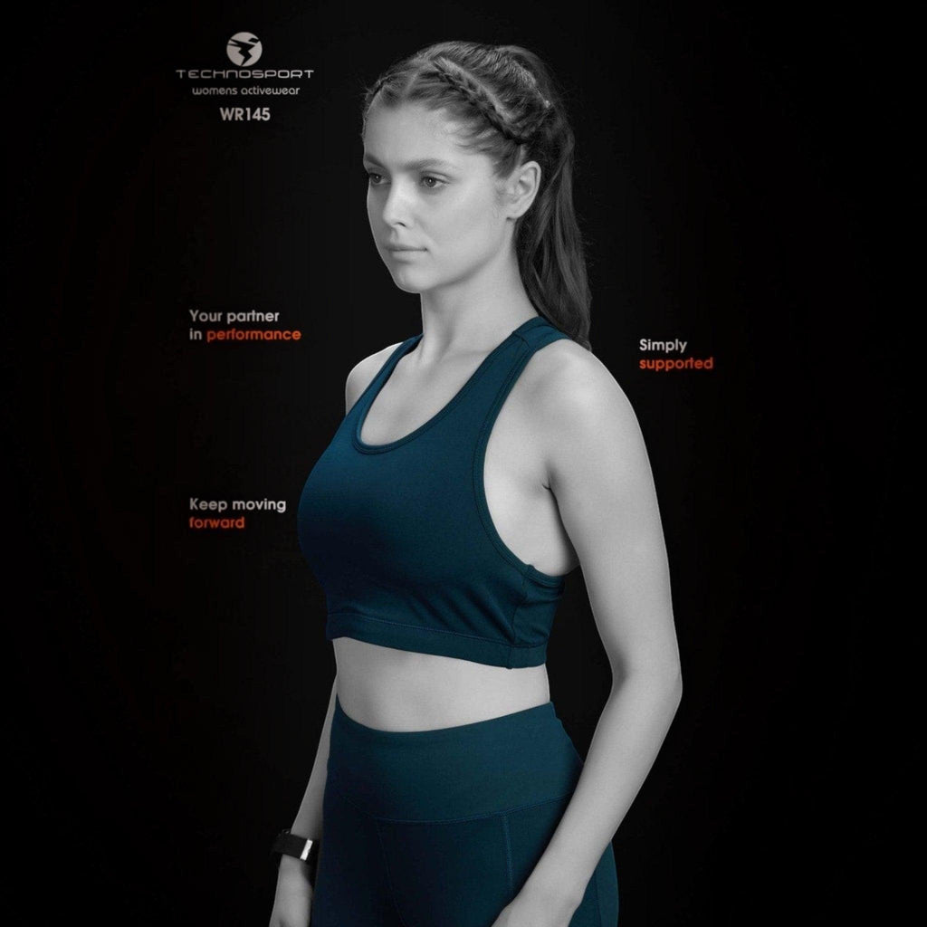 City Center Technosport Elastoplus racer back sports bra in dark blue worn by a woman against a black background