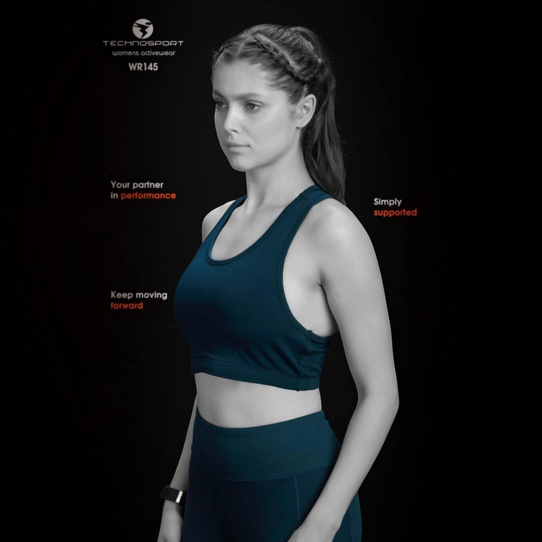 City Center Technosport Elastoplus racer back sports bra in dark blue worn by a woman against a black background