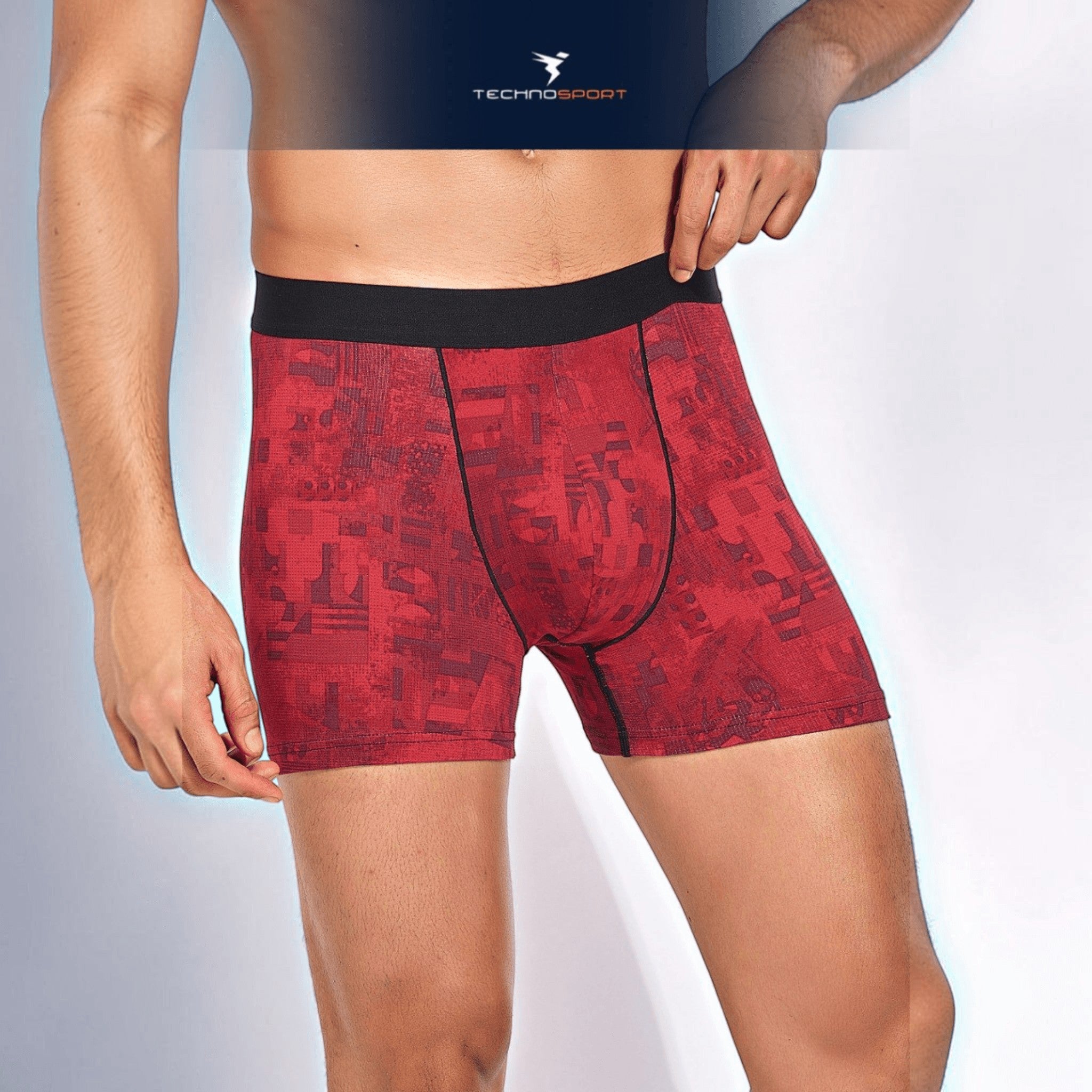 City Center Technosport men's red patterned trunk with a black elastic waistband and performance stretch fabric.