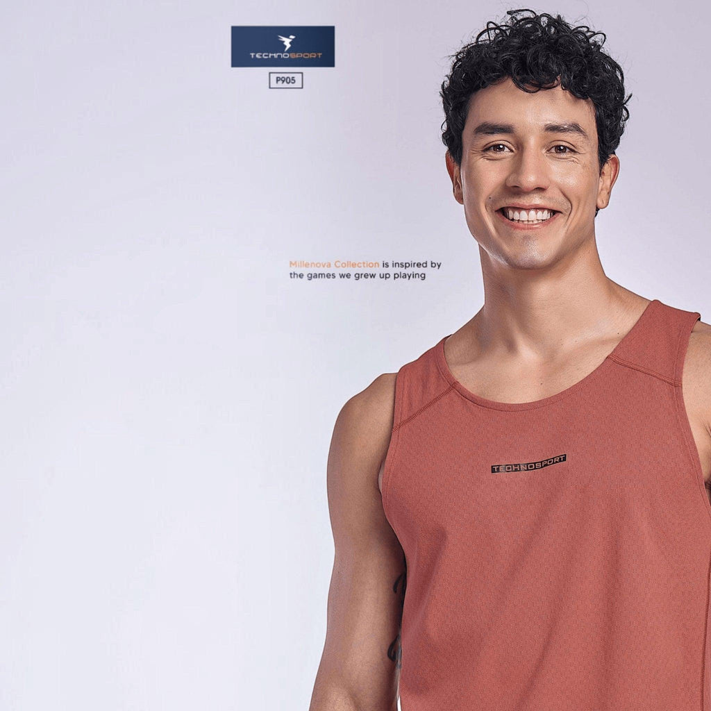 City Center model wearing a rust-colored TECHNOSPORT Millenova sleeveless athletic tank top with moisture-wicking fabric
