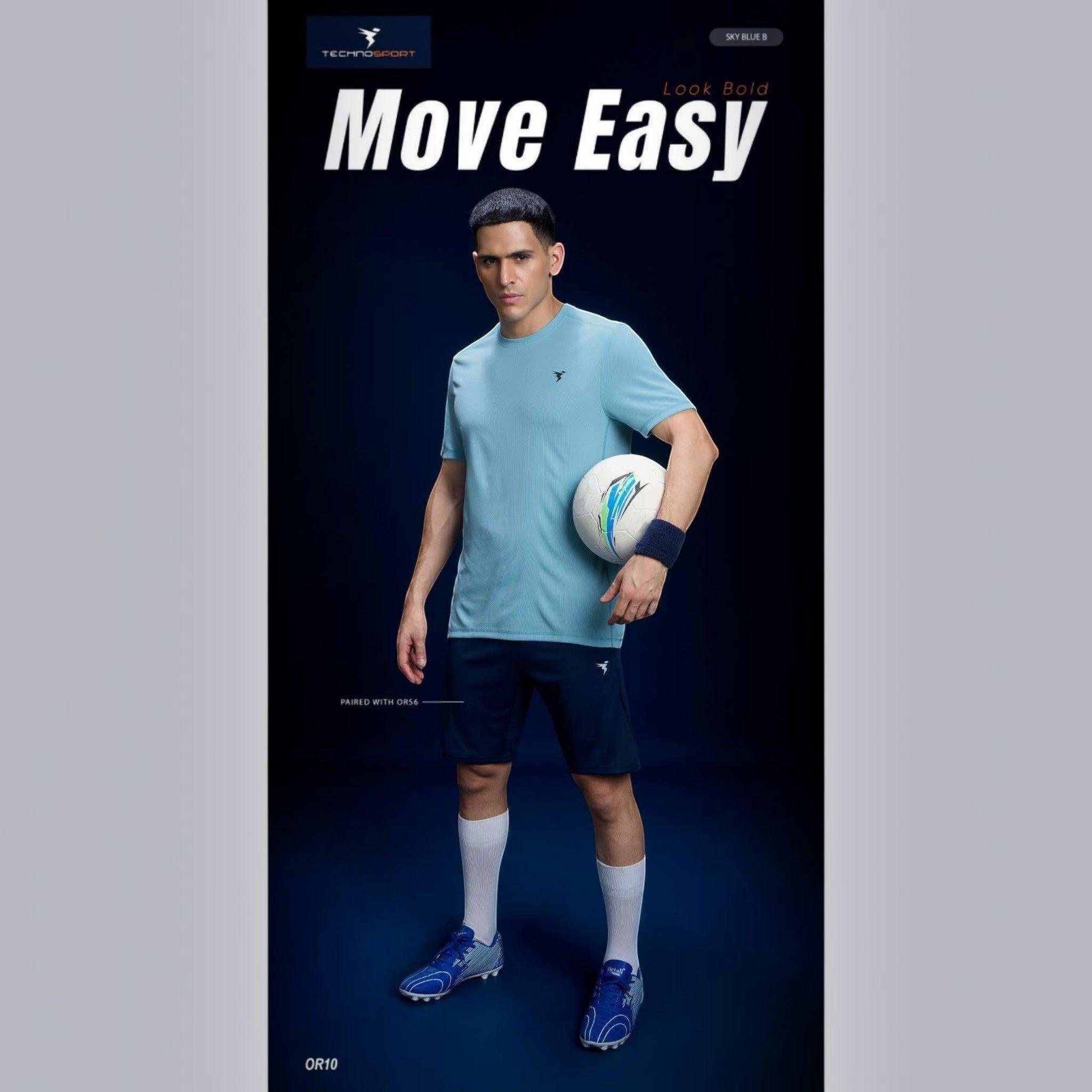 City Center Technosport sky blue slim fit crew neck t-shirt worn by a male athlete holding a soccer ball