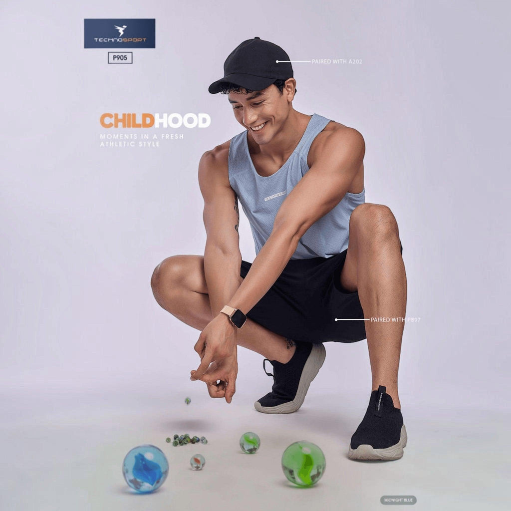 City Center TECHNOSPORT Millenova sleeveless athletic tank top in light blue worn by a man crouching with marbles