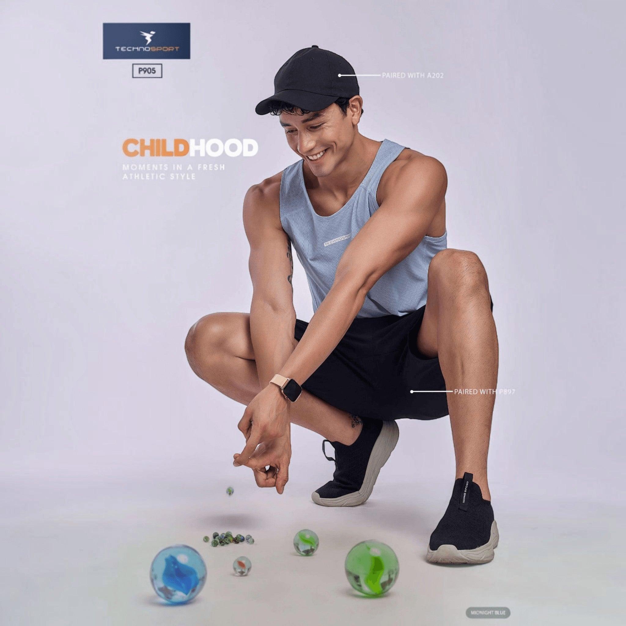 City Center TECHNOSPORT Millenova sleeveless athletic tank top in light blue worn by a man crouching with marbles
