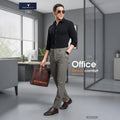 City Center Technosport DuraCool+ formal pants in smokey olive, worn by a man in a black shirt and brown shoes.
