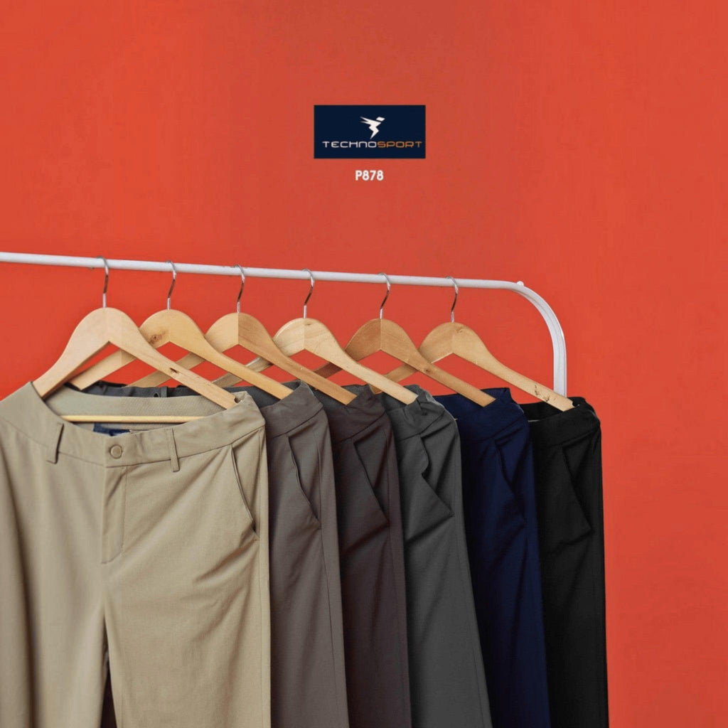 City Center Technosport Duracool+ solid 4-way stretch casual trousers in various neutral colours on a clothing rack