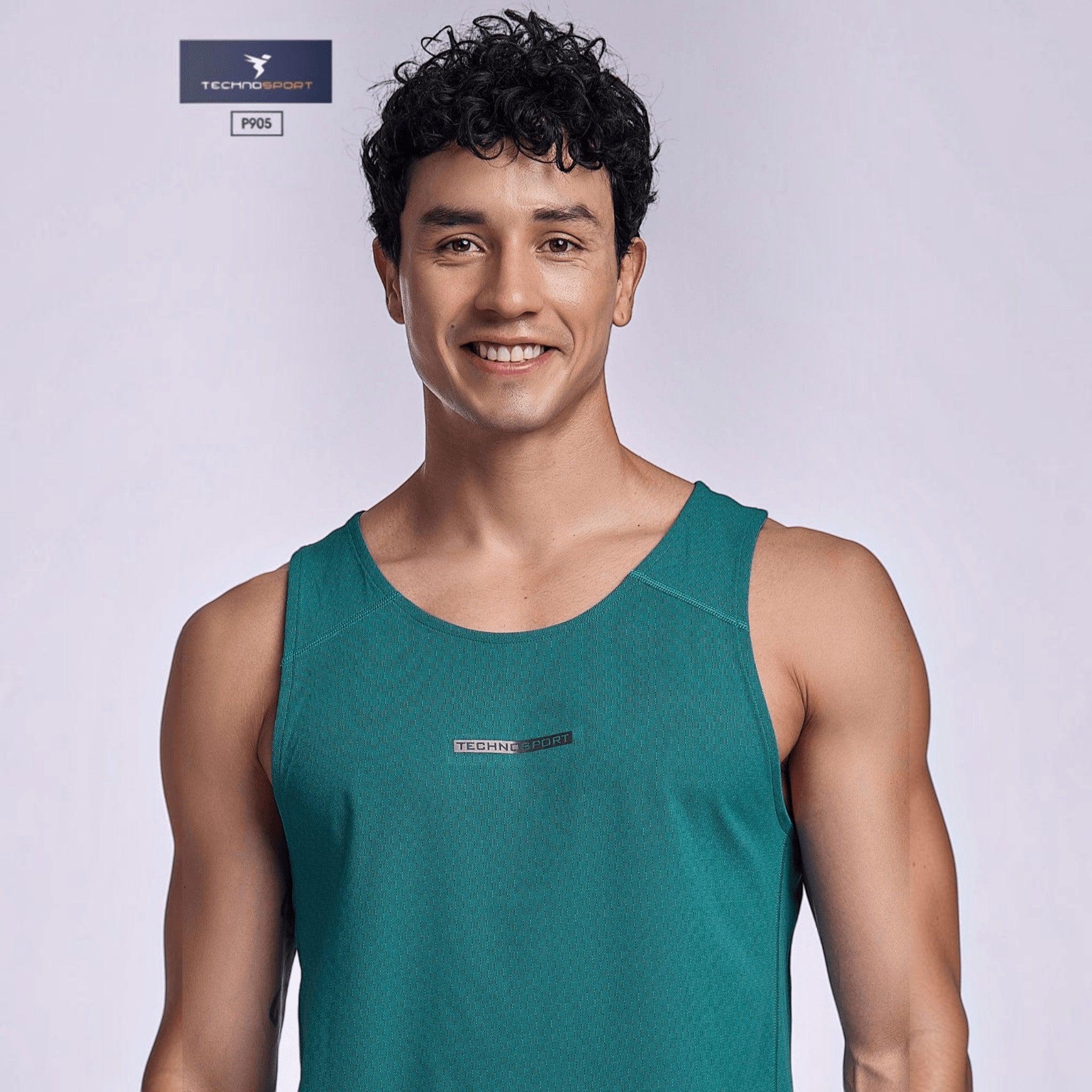 City Center TECHNOSPORT Millenova sleeveless athletic tank top in teal ElastoLITE fabric worn by a smiling man