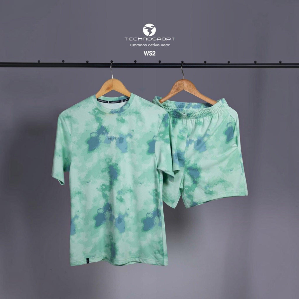City Center Technosport womens activewear set featuring a light green and blue abstract tie-dye t-shirt and shorts.