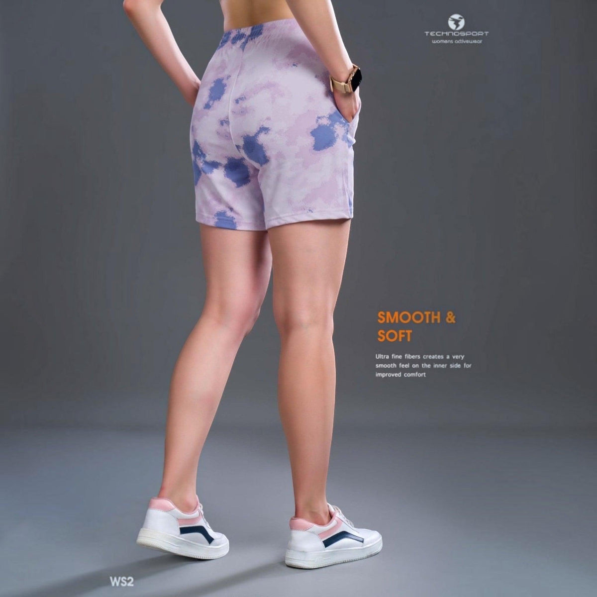City Center Technosport women's tie-dye shorts in purple and white with moisture-wicking fabric and a relaxed fit.
