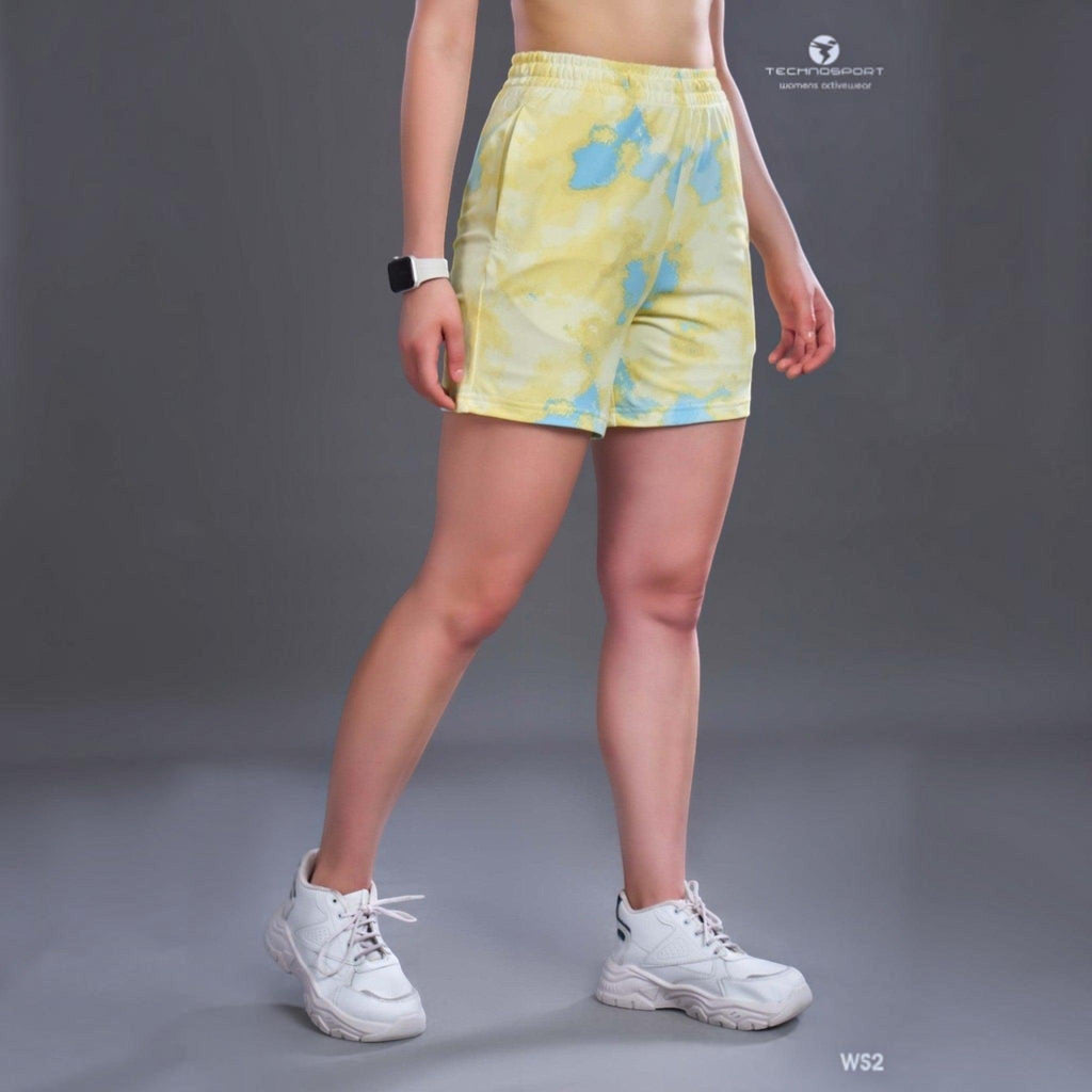 City Center Technosport womens yellow and blue tie-dye athletic shorts with an elastic waistband and white sneakers