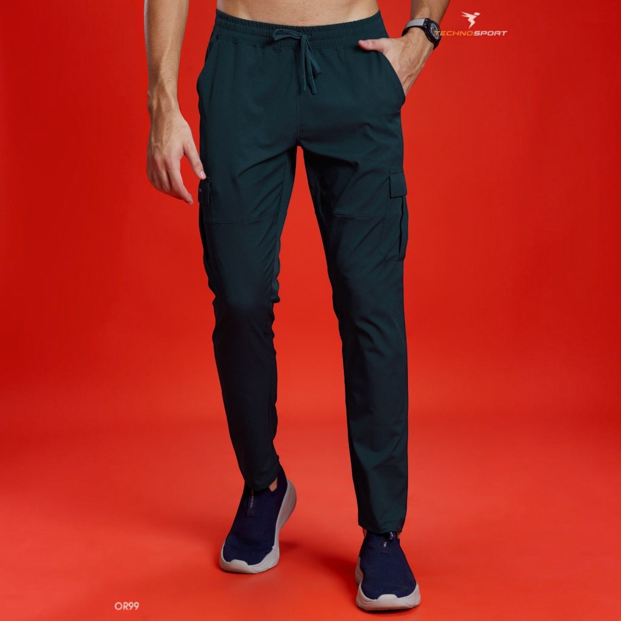 City Center Technosport TS Flexi dark green woven cargo pants with a straight fit and side pockets on a red background.