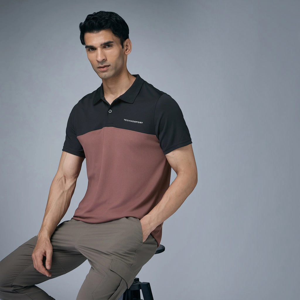 City Center model wearing a two-tone black and mauve Technosport collar neck performance t-shirt with cargo trousers