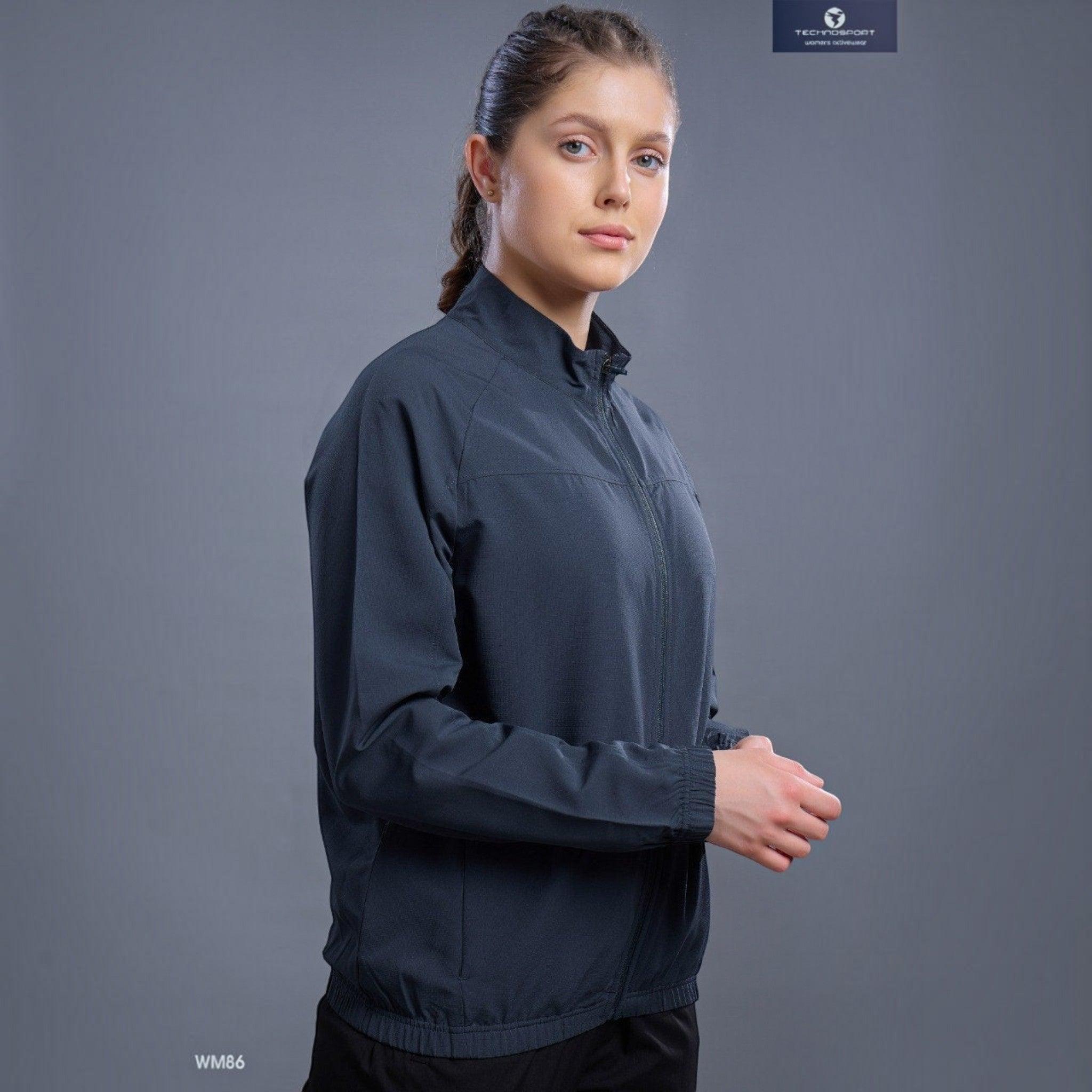 City Center Technosport WM86 dark grey lightweight athletic zip-up jacket worn by a woman against a grey background