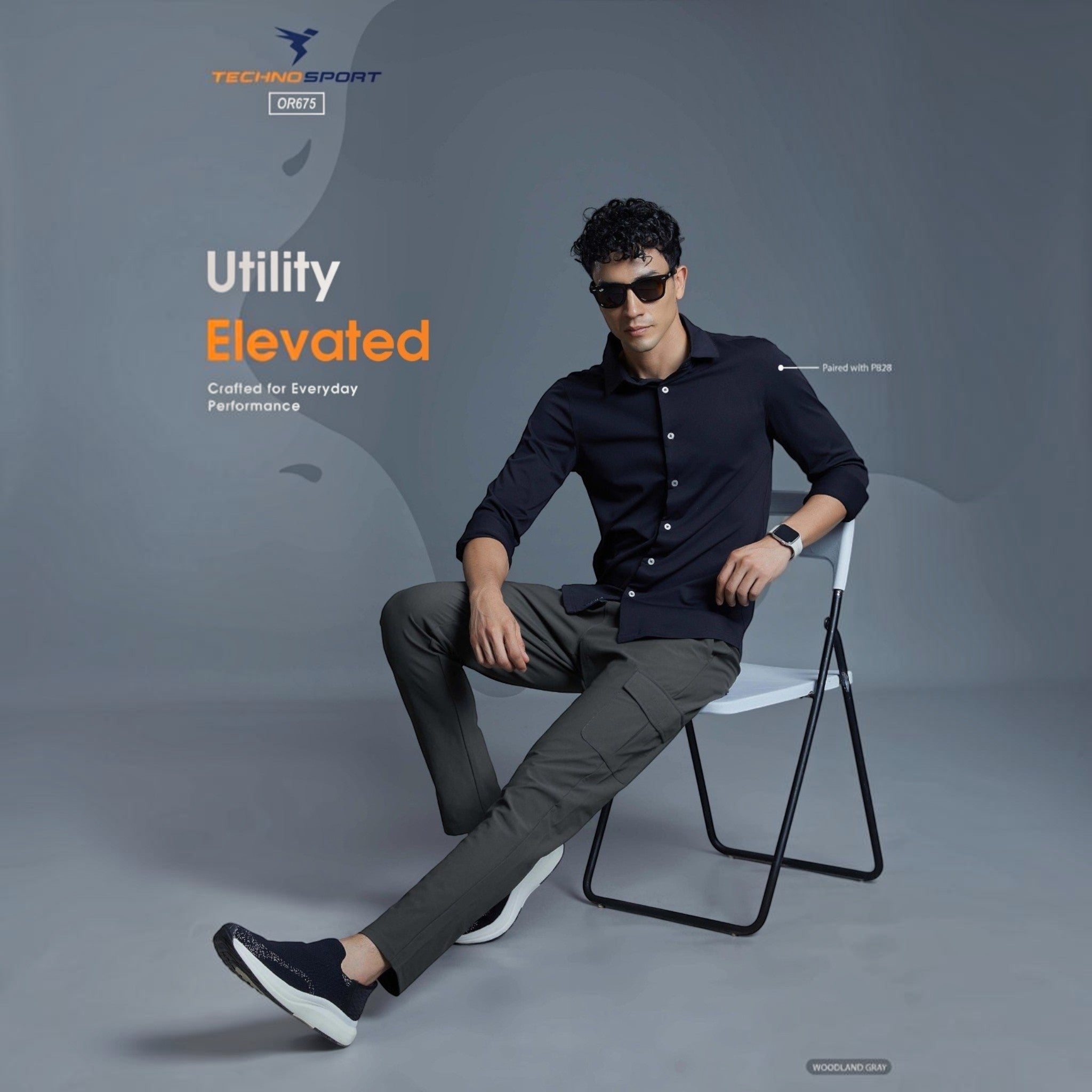 City Center model wearing Technosport OR675 woodland gray tapered track pants with a black shirt and sunglasses