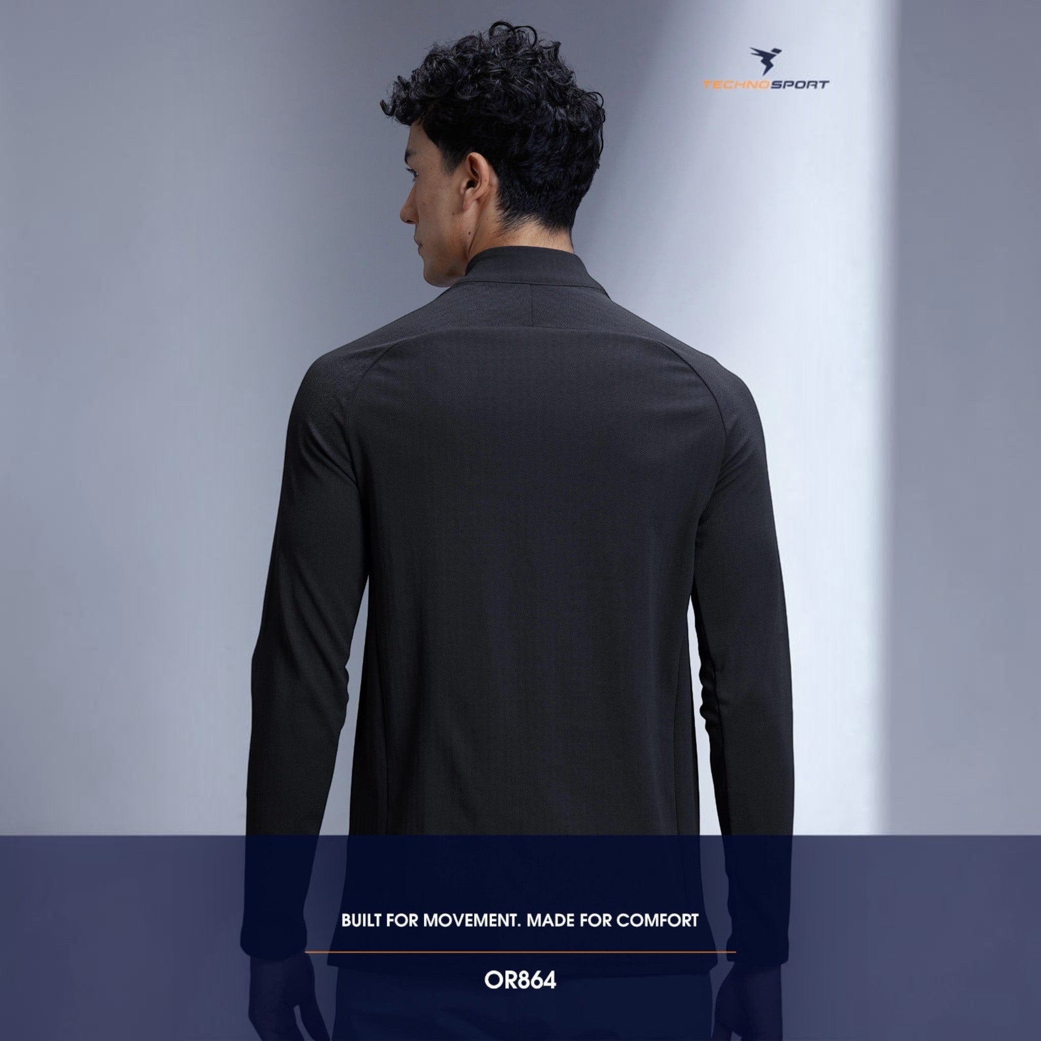 Back view of a man wearing a black City Center TECHNOSPORTS CloudFlex high neck long sleeve athletic tee