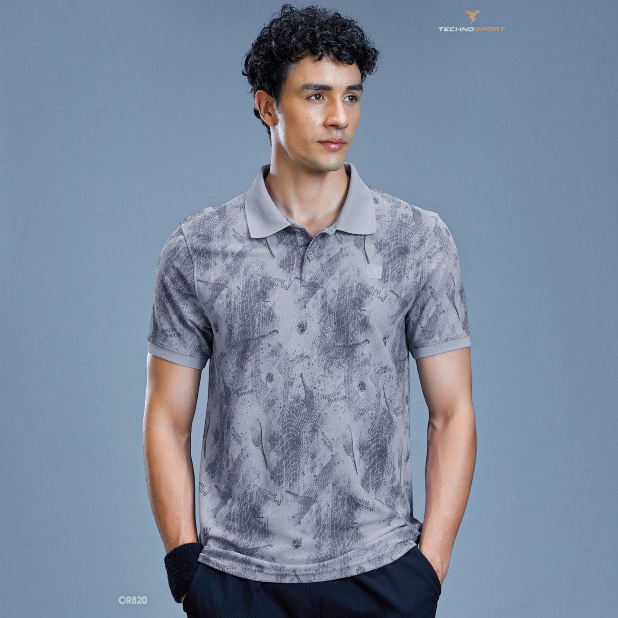 City Center TECHNOSPORTS OR820 grey performance polo shirt with a subtle abstract print worn by a male model.