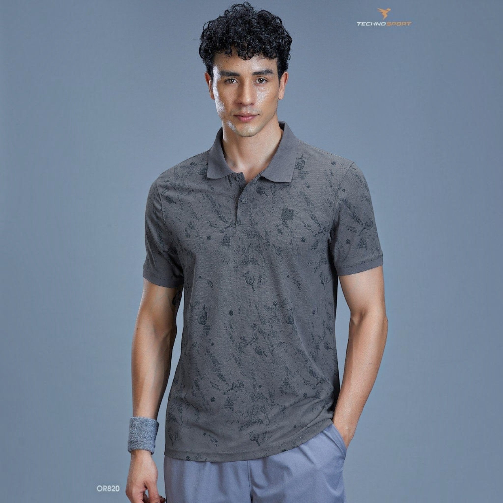 City Center TECHNOSPORTS OR820 grey performance polo shirt with subtle graphic print worn by a male athlete