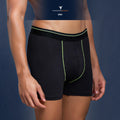 City Center Technosports OR53 men's black athletic trunk in 4-way stretch Lycra mesh with neon green accent stitching.