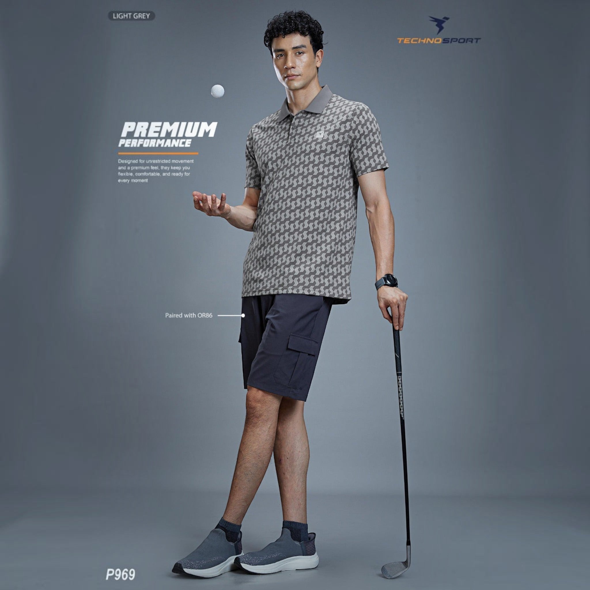 City Center model wearing a light grey patterned TECHNOSPORTS P969 performance polo shirt and dark shorts with a golf club