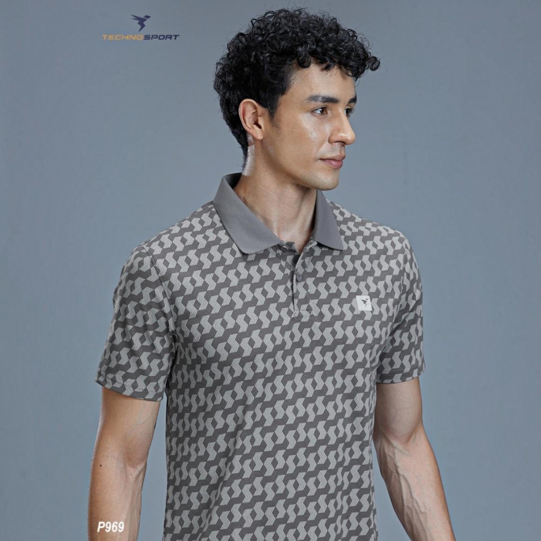 City Center TECHNOSPORTS P969 performance polo shirt in grey with a geometric pattern, worn by a male model.