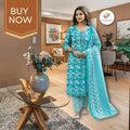 City Center turquoise cotton kurti set with white floral Jaipuri print, matching pants, and dupatta on a model.