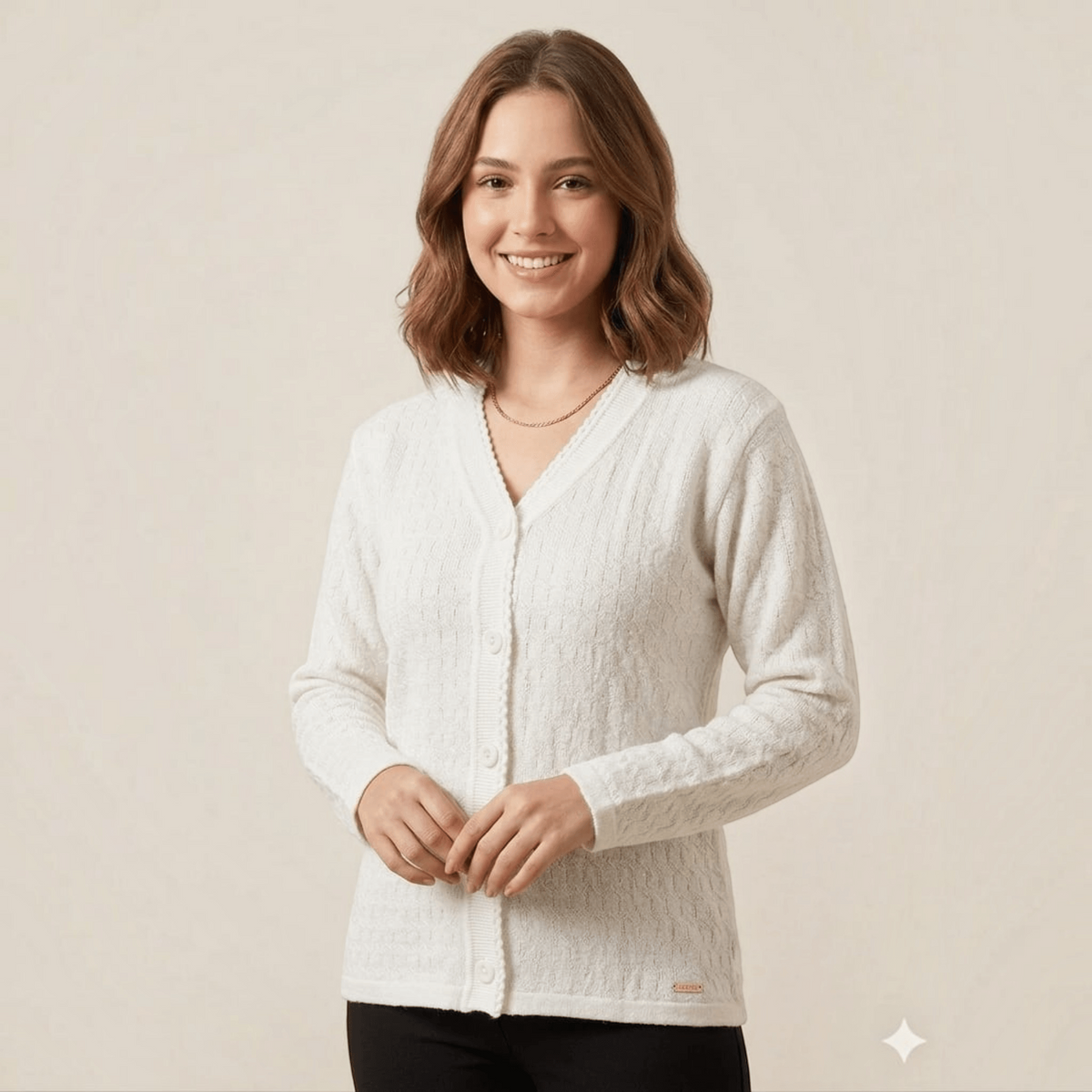 City Center white V-neck button-down cardigan sweater in a soft, lightweight knit fabric worn by a smiling woman.