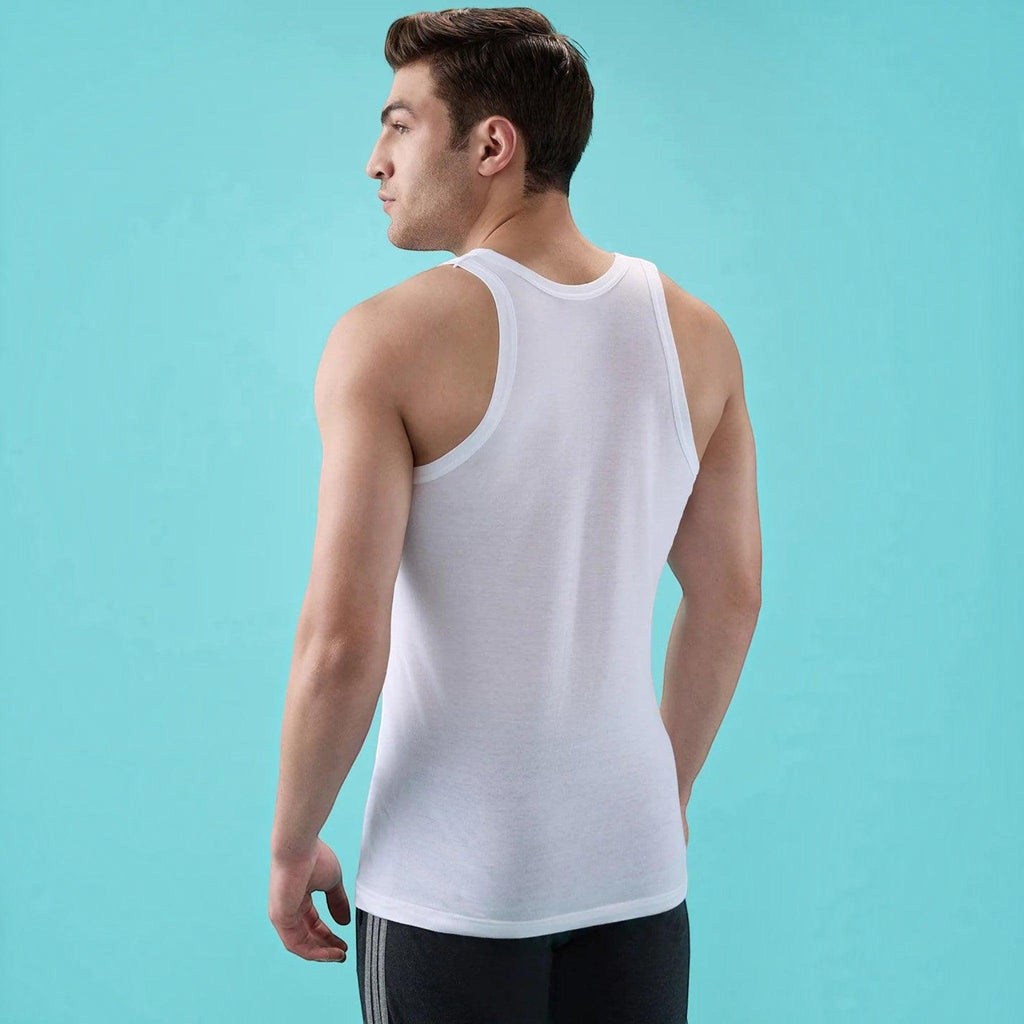 City Center white round neck cotton vest worn by a man, showing a tailored fit and contoured armholes from the back.