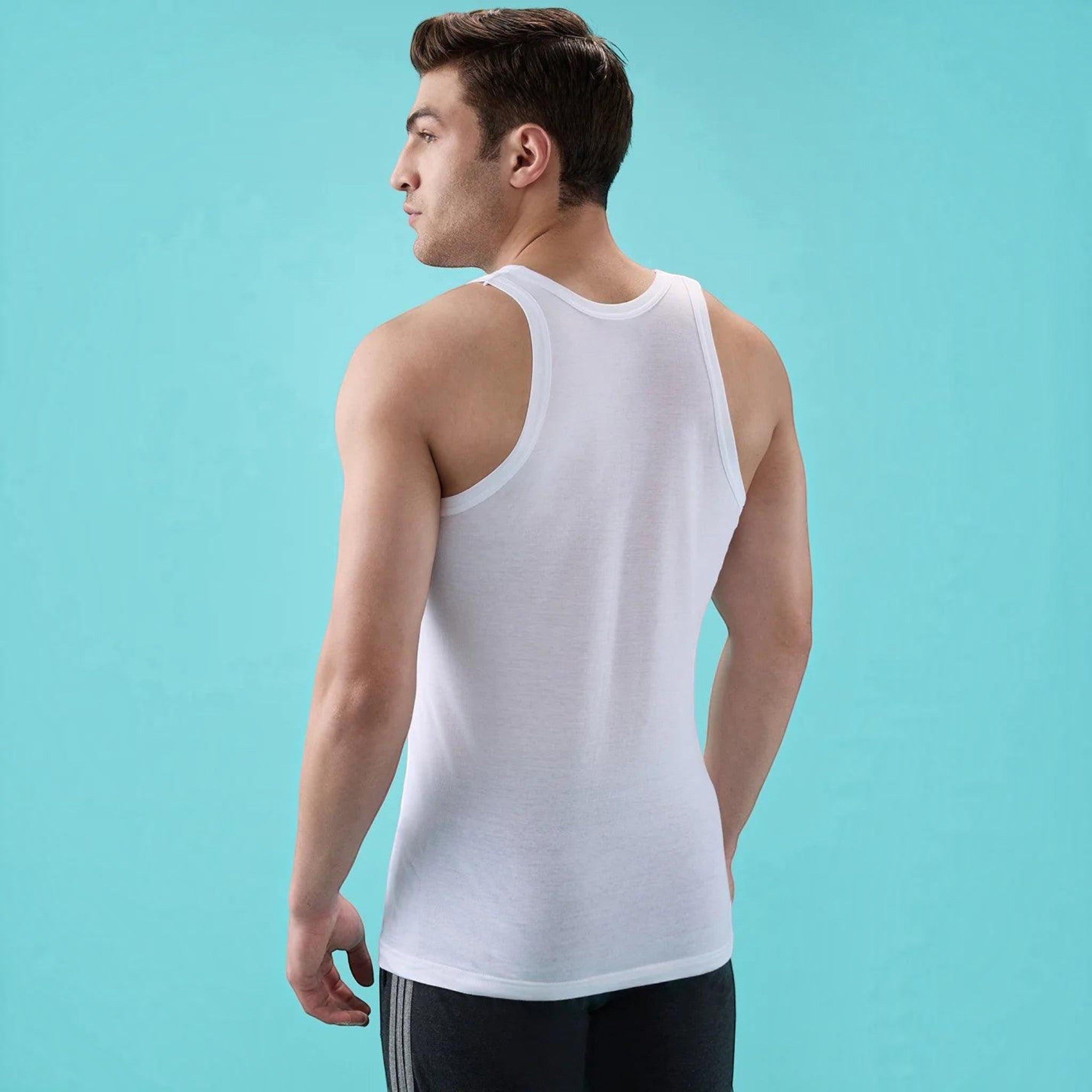 City Center white round neck cotton vest worn by a man, showing a tailored fit and contoured armholes from the back.