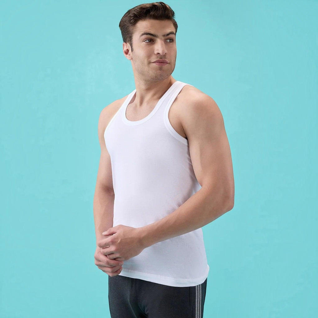 City Center white Macho Metro round neck cotton vest worn by a man against a light blue background