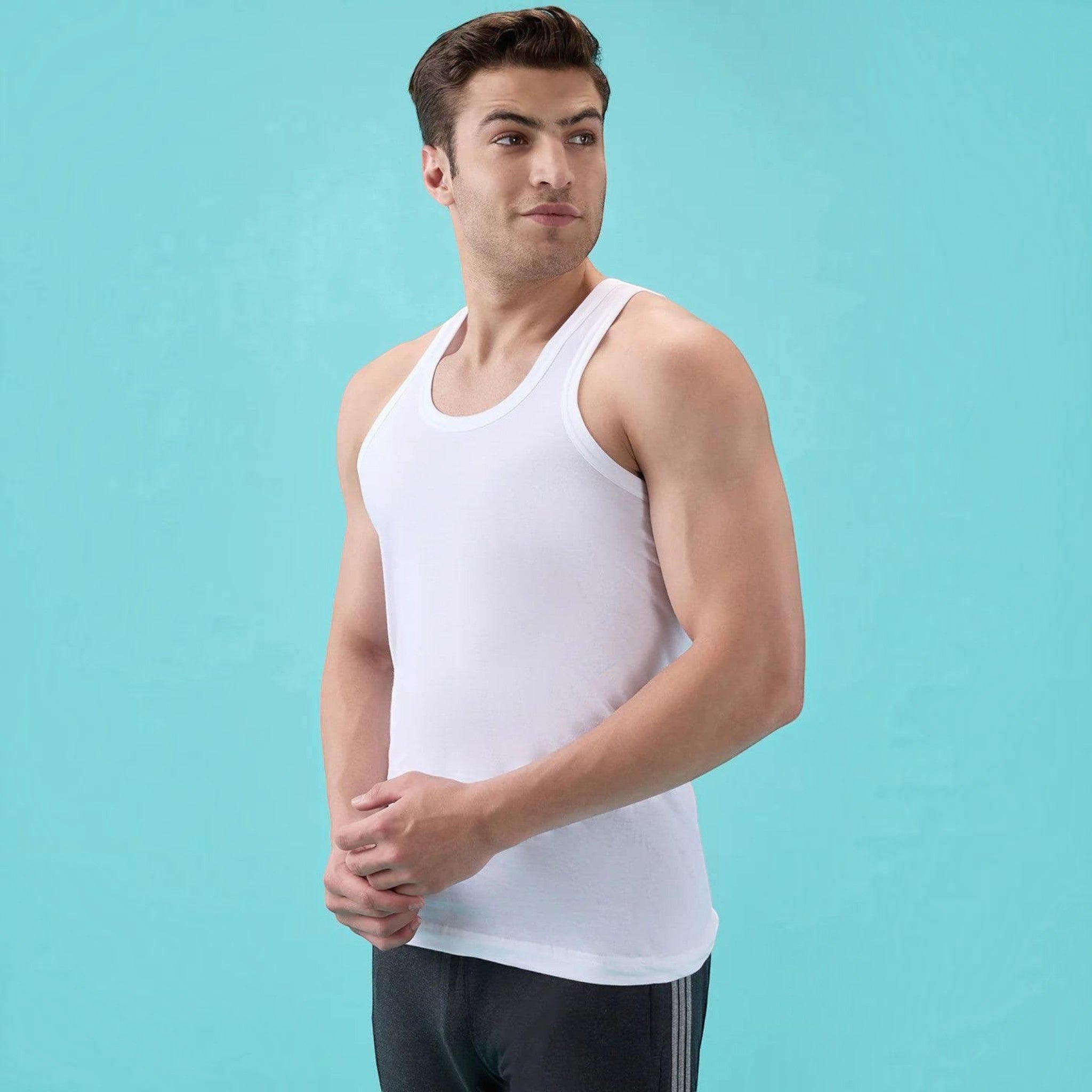 City Center white Macho Metro round neck cotton vest worn by a man against a light blue background
