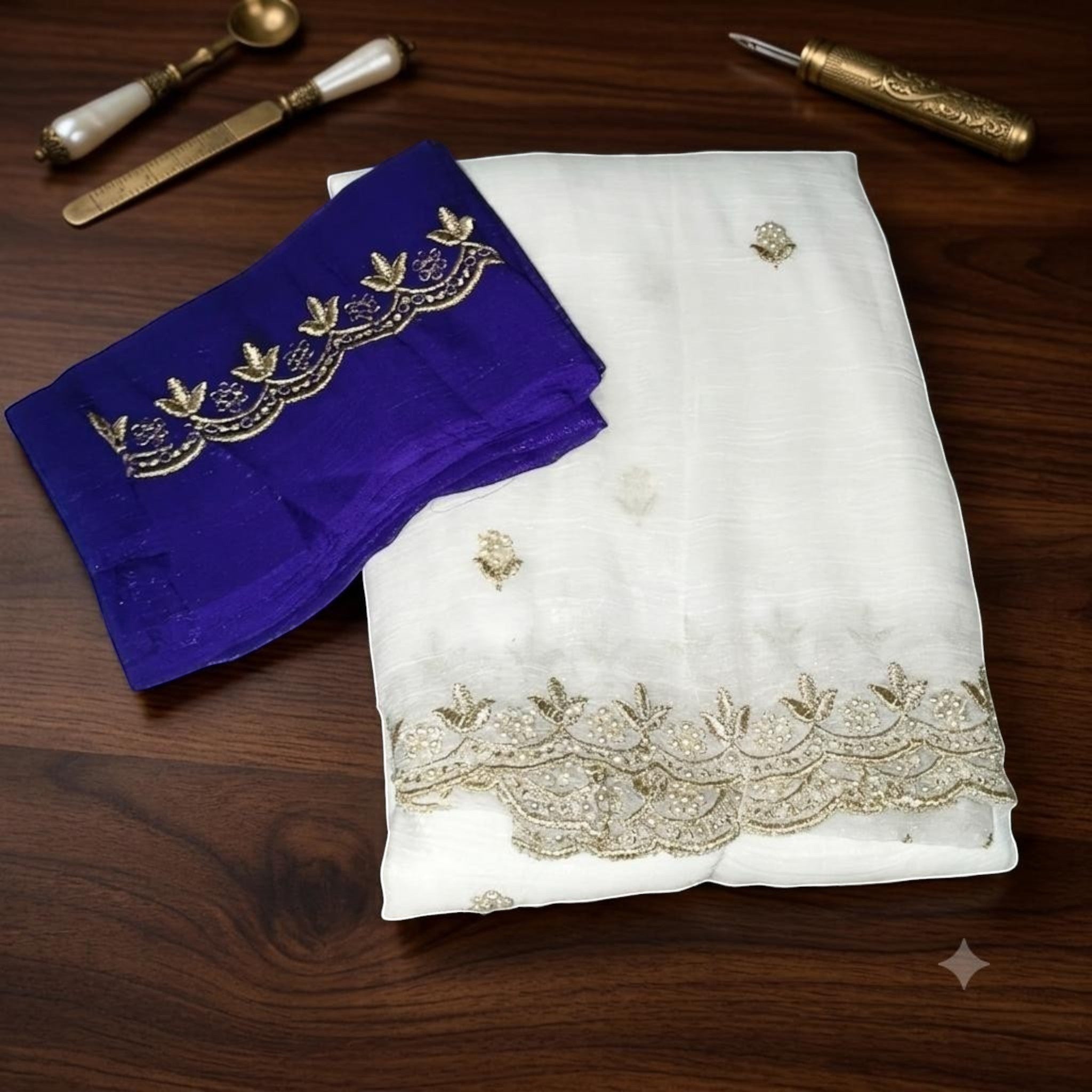 City Center MotiCrunch saree in white crinkle fabric with gold pearl embroidery and a contrasting royal blue blouse