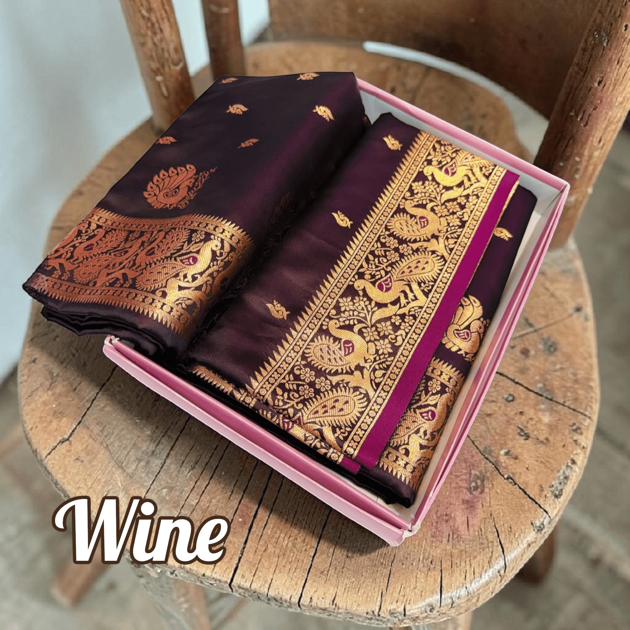 City Center wine handwoven Peshwai Paithani silk saree with intricate gold zari peacock motifs in a gift box