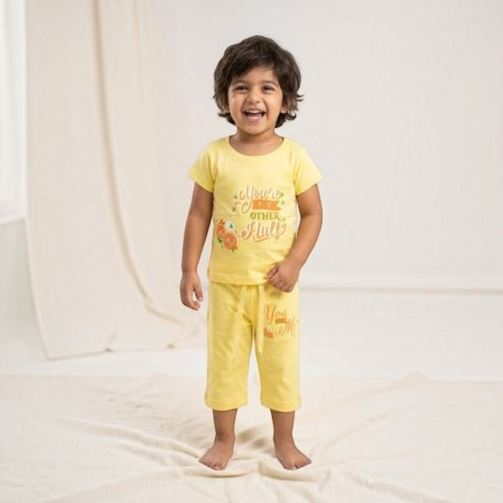 City Center kids honey girl co-ord set featuring a yellow short-sleeve top and matching cropped pants with prints