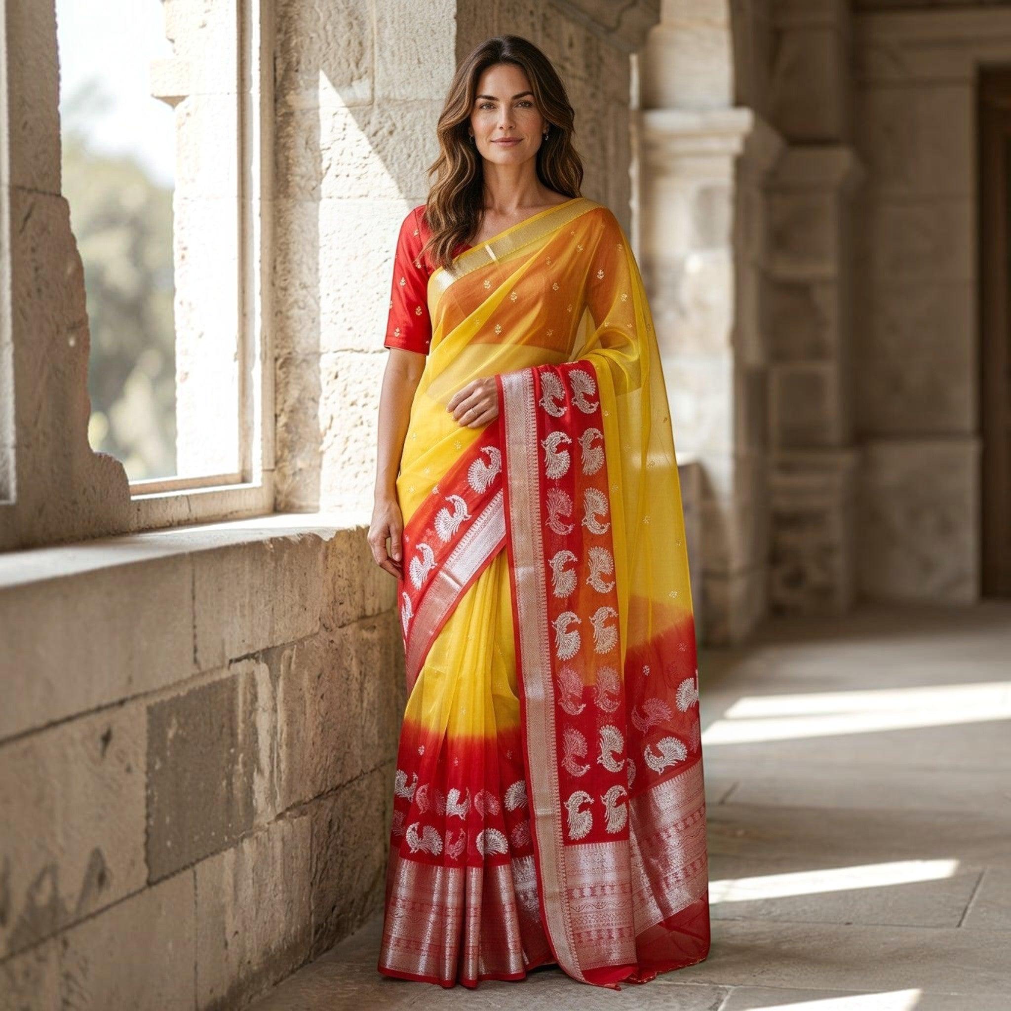 City Center yellow and red organza saree with silver peacock motifs and matching blouse worn by a woman