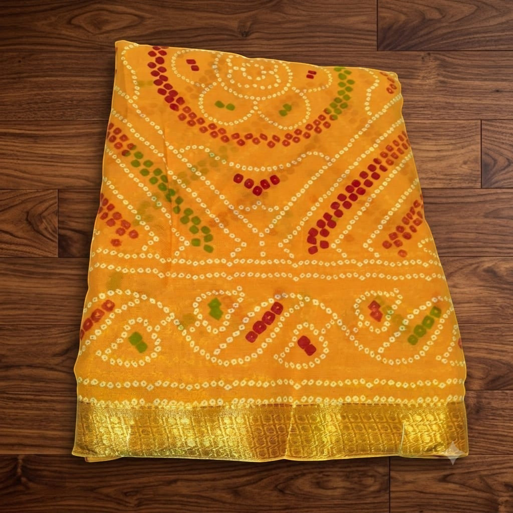 City Center yellow silk Bandhani saree featuring intricate traditional tie-dye patterns and a gold woven border.